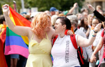 <p>Revelers take part in the Pride parade as it makes its way through the city center, in Belfast, Northern Ireland, Saturday Aug. 5, 2017. (Photo: Peter Morrison/PA via AP) </p>