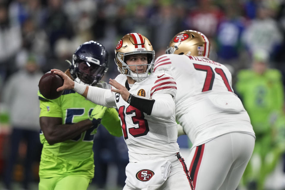 San Francisco 49ers quarterback Brock Purdy throws during the first half of an NFL football game against the Seattle Seahawks, Thursday, Nov. 23, 2023, in Seattle. (AP Photo/Stephen Brashear)