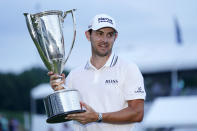 Patrick Cantlay holds the FedExs Cup after winning the BMW Championship golf tournament, Sunday, Aug. 29, 2021, at Caves Valley Golf Club in Owings Mills, Md. (AP Photo/Julio Cortez)