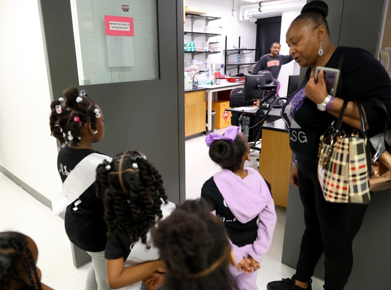 Maudie Simpson talks recently with the ONE Lupus Support Group Butterfly Pageant participants as they tour Oklahoma Medical Research Foundation in Oklahoma City.