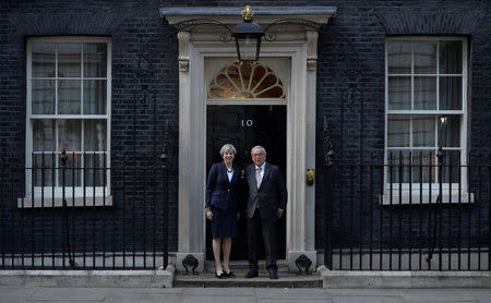 Britain's Prime Minister Theresa May welcomes Head of the European Commission, President Jean-Claude Juncker to Downing Street in London, Britain April 26, 2017. REUTERS/Hannah McKay