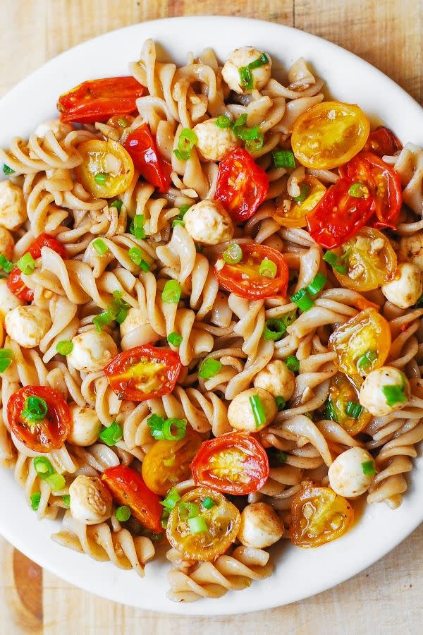 <p>You don't have to give up the classic side dish, just make it healthier.</p><p>Get the recipe from <a rel="nofollow noopener" href="http://juliasalbum.com/2015/06/pasta-salad-with-roasted-tomatoes-and-mozzarella/#more-7223" target="_blank" data-ylk="slk:Julia's Album;elm:context_link;itc:0;sec:content-canvas" class="link ">Julia's Album</a>.</p>