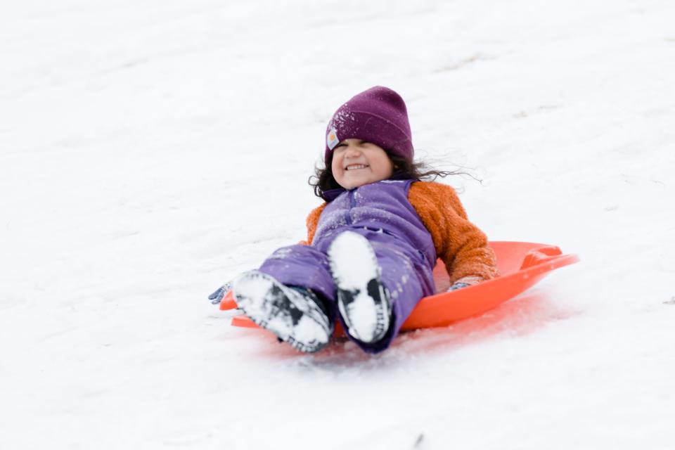 Teotle De Tlalli slides down a hill at Memorial Park in Central El Paso on Feb. 3, 2022. The Borderland has a chance of snow accumulation late Sunday or early Monday.