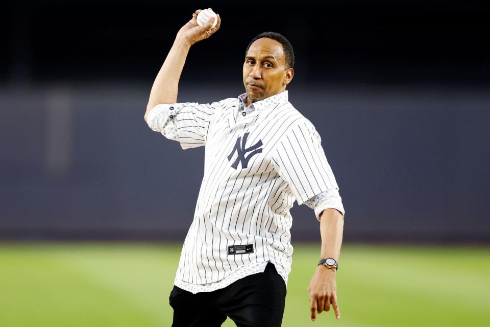 <p>Sarah Stier/Getty</p> American TV personality Stephen A. Smith throws a ceremonial first pitch before the first inning of the game between the New York Yankees and the Toronto Blue Jays at Yankee Stadium on September 21, 2023 in the Bronx borough of New York City. 
