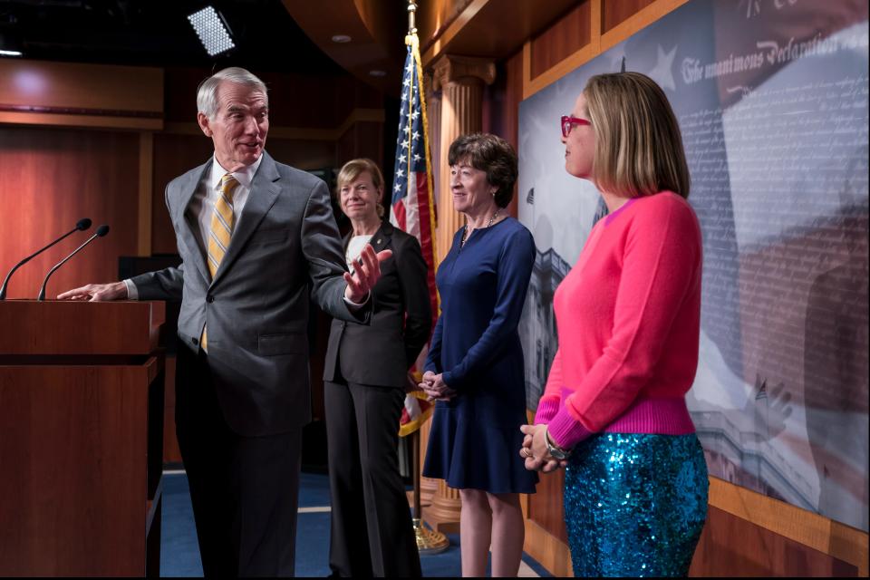 From left, Sen. Rob Portman, R-Ohio, Sen. Tammy Baldwin, D-Wis., Sen. Susan Collins, R-Maine, and Sen. Kyrsten Sinema, D-Ariz., talk with reporters following Senate passage of the Respect for Marriage Act, at the Capitol in Washington, Tuesday, Nov. 29, 2022.