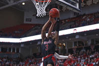 Arkansas State's Desi Sills (3) is fouled by Texas Tech's Kevin McCullar (15) during the first half of an NCAA college basketball game on Tuesday, Dec. 14, 2021, in Lubbock, Texas. (AP Photo/Brad Tollefson)
