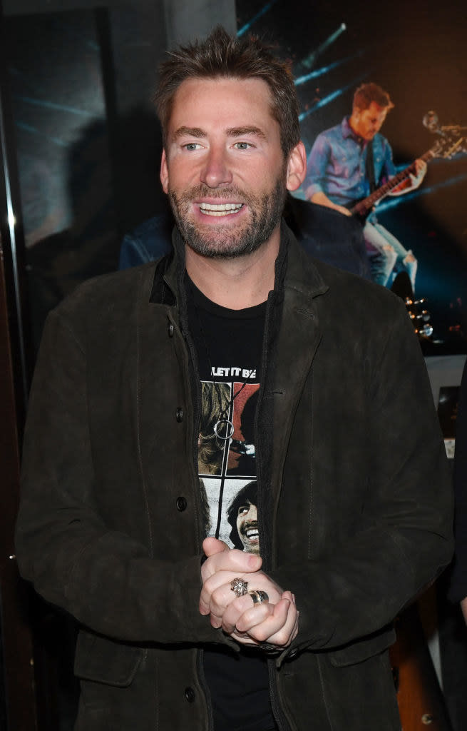 Chad smiling and wearing a Beatles "Let It Be" T-shirt