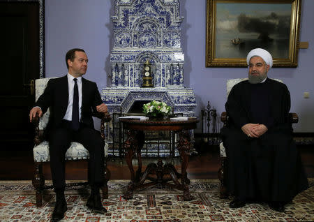 Russian Prime Minister Dmitry Medvedev meets with Iranian President Hassan Rouhani at the Gorki state residence outside Moscow, Russia March 27, 2017. Sputnik/Pool/Ekaterina Shtukina via REUTERS