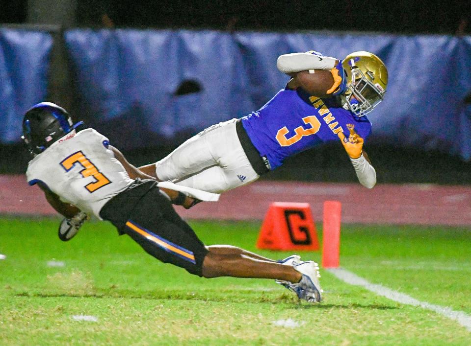 Cardinal Newman wide receiver Nae’Shaun Montgomery (3) catches a touchdown pass against John Carroll during a 40-7 victory Monday night in West Palm Beach.
