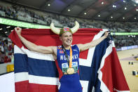 Karsten Warholm, of Norway celebrates winning the gold medal in the Men's 400-meters hurdles final during the World Athletics Championships in Budapest, Hungary, Wednesday, Aug. 23, 2023. (AP Photo/Bernat Armangue)