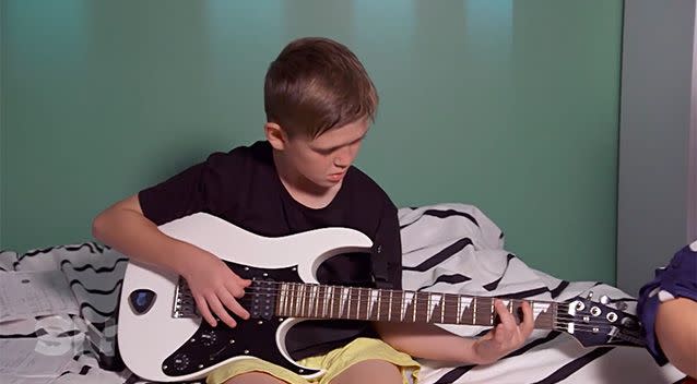Cameron loves to play guitar, and finds that it helps his Tourette's.