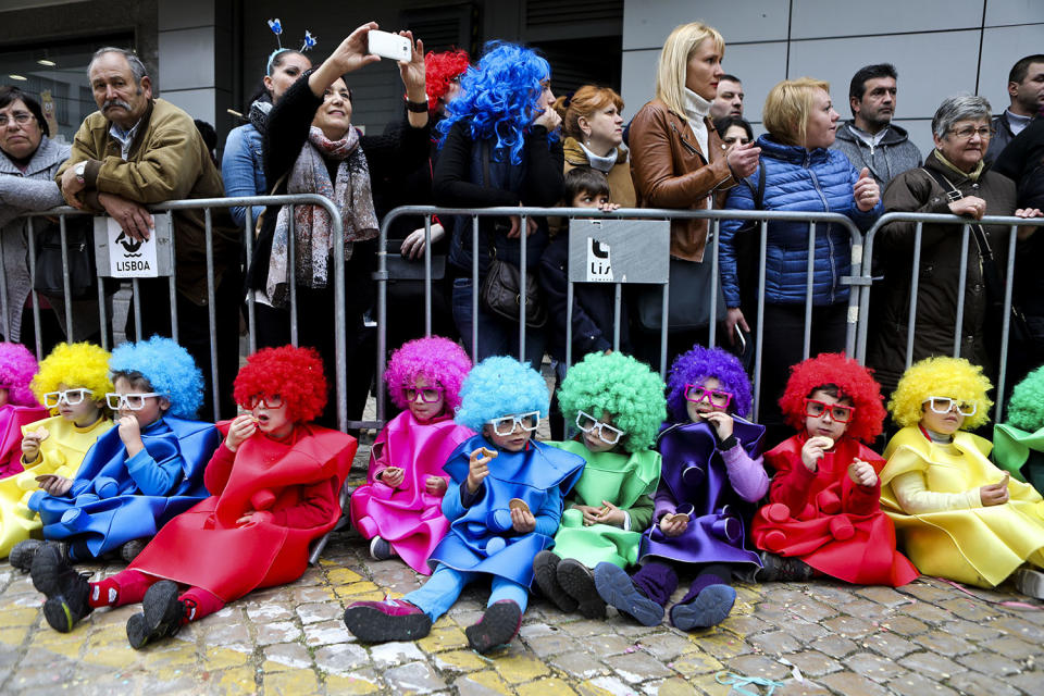 <p>Children dressed as clowns take a break from the children’s carnival parade in Torres Vedras, Portugal, Feb. 24, 2017. The Carnival of Torres Vedras features several parades with the children’s parade featuring elementary and middle school students wearing masks or costumes they have made themselves. (Photo: Mibuel A. Lopes/EPA) </p>
