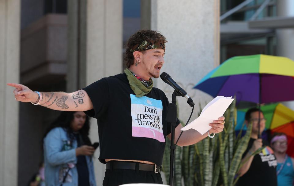 Lindsey Spero, 26, addresses the crowd before the start of the National March to Protect Trans Youth Saturday, Oct. 7, 2023 in Orlando.