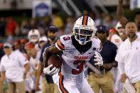 Syracuse wide receiver Taj Harris (3) runs with the ball during an NCAA football game against Ohio in Athens, Ohio, Saturday, Sept. 4, 2021. Syracuse wide receiver Taj Harris is taking his talents elsewhere. Orange coach Dino Babers confirmed Monday, Oct. 4, 2021, that the junior has decided to enter the transfer portal. (AP Photo/Kirk Irwin)