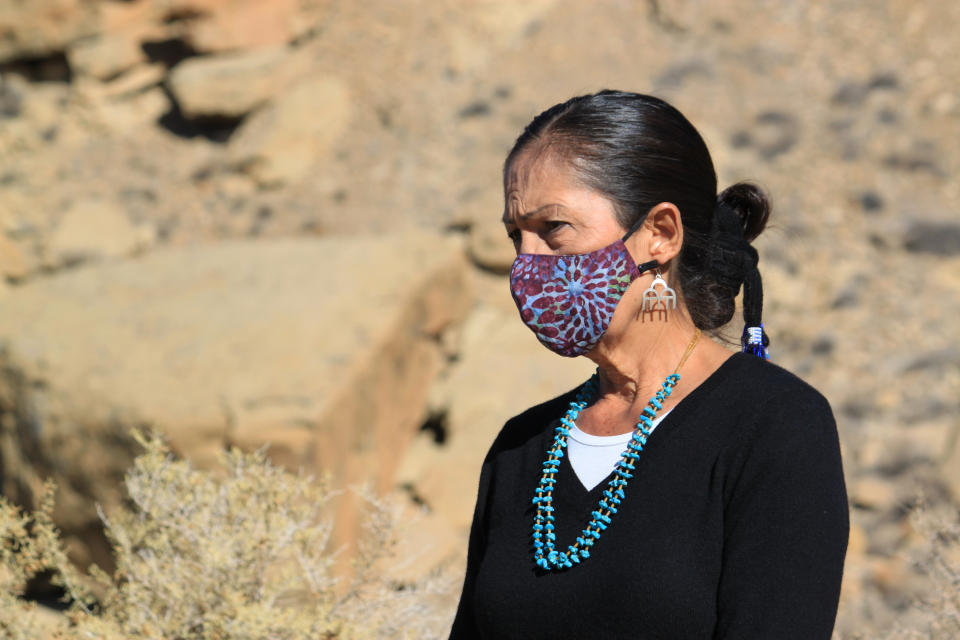 U.S. Interior Secretary Deb Haaland prepares to answer questions following a celebration at Chaco Culture National Historical Park in northwestern New Mexico on Monday, Nov. 22, 2021. Haaland called the day momentous, referring to recent action taken by the Biden administration to begin the process of withdrawing federal land from oil and gas development within a 10-mile radius of the park's boundaries for 20 years. Some Indigenous leaders were elated with the action, saying it marks a step toward permanent protection of the area outside the park. (AP Photo/Susan Montoya Bryan)