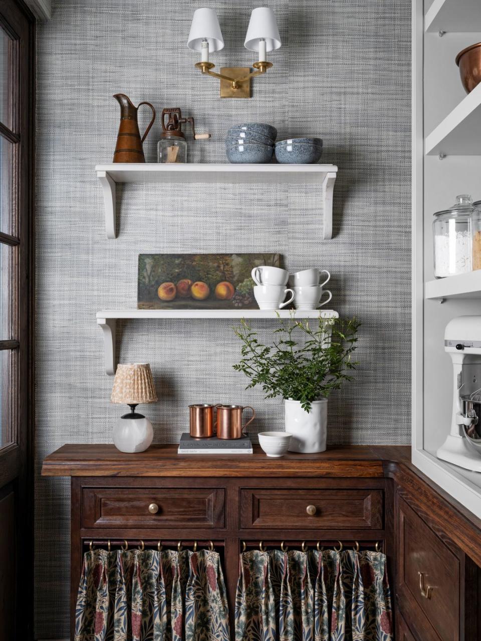 stocked shelves across from the scullery, a walk in pantry keeps small appliances and kitchenware from wayfair within reach fixed lower shelves are paneled with caesarstone, while upper shelves are adjustable