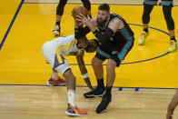 Memphis Grizzlies center Jonas Valanciunas, right, grabs the ball over Golden State Warriors forward Kent Bazemore during the second half of an NBA basketball game in San Francisco, Sunday, May 16, 2021. (AP Photo/Jeff Chiu)