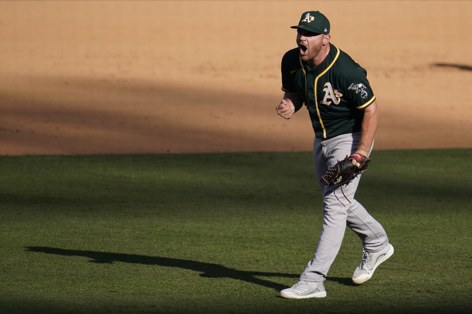 Oakland Athletics pitcher Liam Hendriks reacts after the Athletics defeated the Houston Astros in Game 3 of a baseball American League Division Series against the Houston Astros in Los Angeles, Wednesday, Oct. 7, 2020. (AP Photo/Marcio Jose Sanchez)