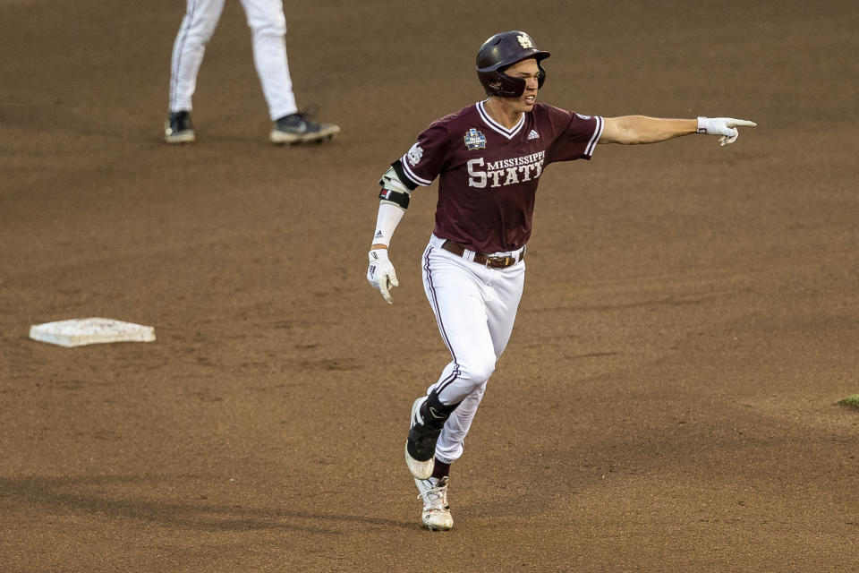 Mississippi State infielder Kellum Clark (11) runs the bases after hitting a homer in the eighth inning with Scott Dubrule also scoring against Virginia during a baseball game in the College World Series Tuesday, June 22, 2021, at TD Ameritrade Park in Omaha, Neb. (AP Photo/John Peterson)