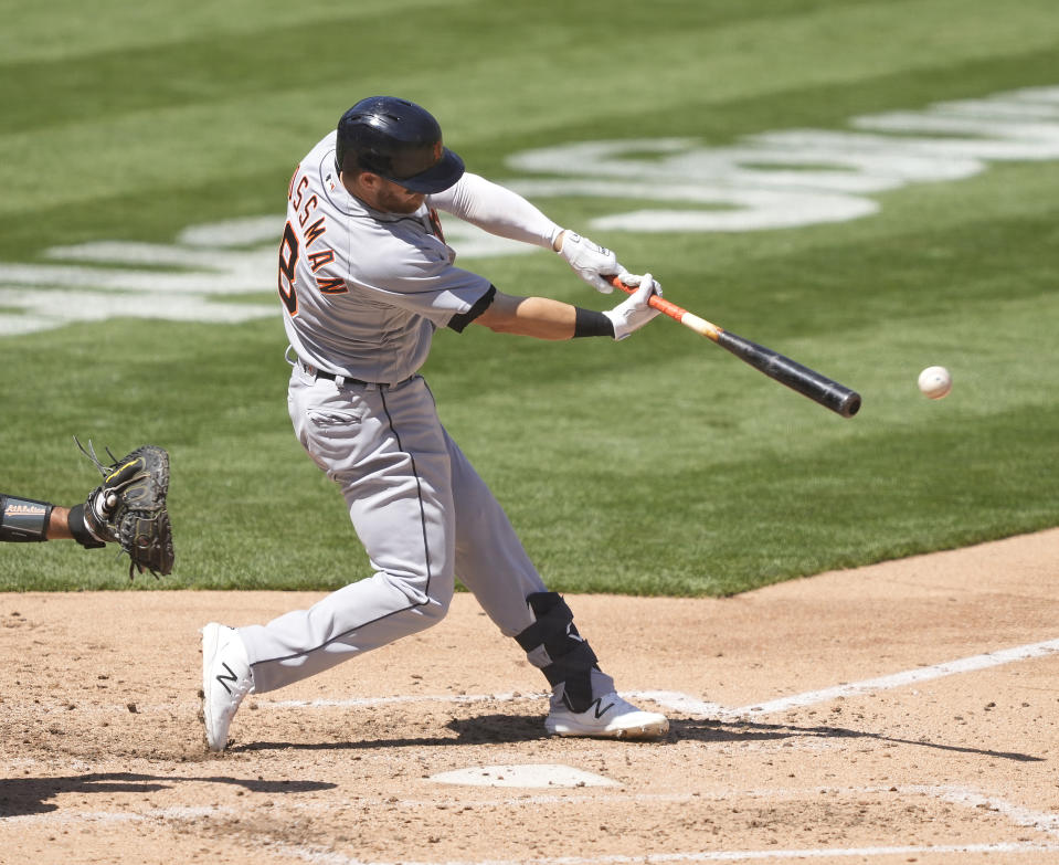 Detroit Tigers' Robbie Grossman (8) hits a single against the Oakland Athletics during the fifth inning of a baseball game on Saturday, April 17, 2021, in Oakland, Calif. (AP Photo/Tony Avelar)