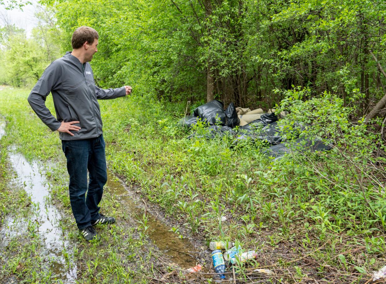 Peter A. Bratt, Milwaukee County Parks Director of Operations & Skilled Trades, finds illegally dumped items along the Little Menomonee River Parkway on Thursday, May 26, 2022 in Milwaukee, Wis.



Jovanny Hernandez / Milwaukee Journal Sentinel