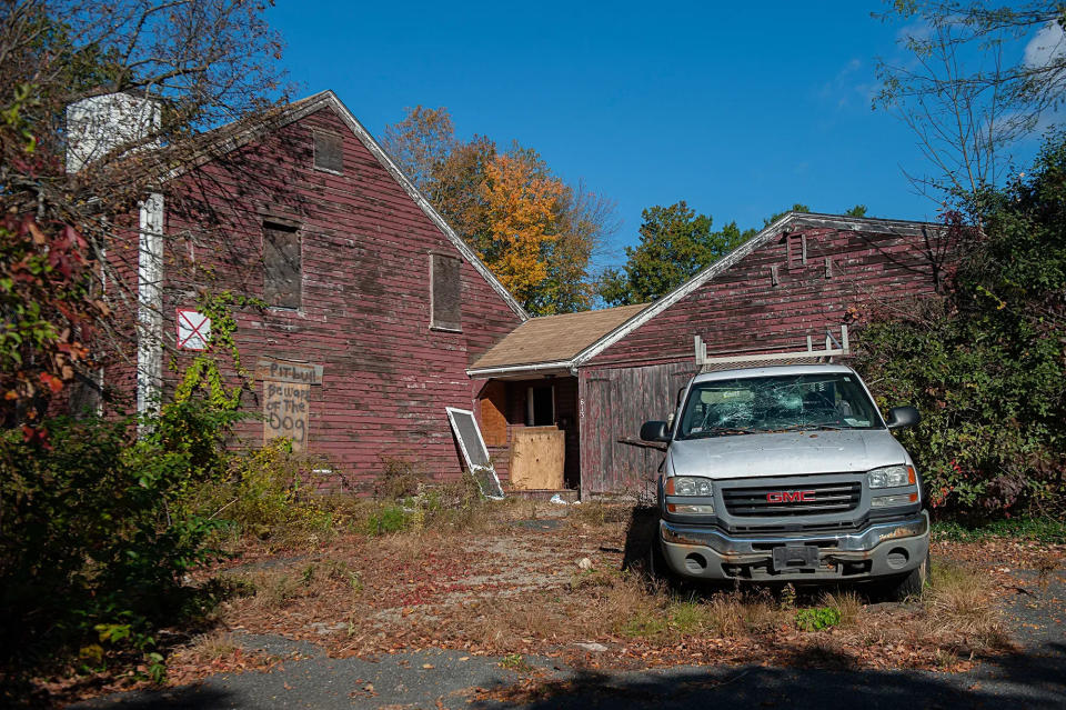 The owner of the historic Hemenway House on Pleasant Street in Framingham proposes having the garage and barn demolished to accommodate up to two additional units.