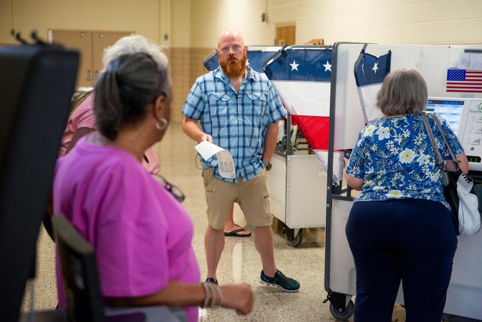 Albert Alexander walks to turn in his ballot after filling it out at the Community Montessori School polling location in the last hour before the polls close on Thursday, August 4, 2022, in Jackson, TN.