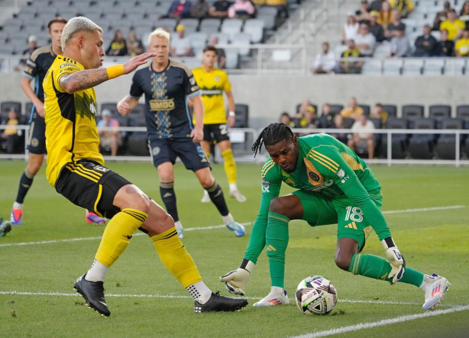 August 21, 2024; Columbus, Ohio, USA; 
Columbus Crew forward Christian Ramirez (17) challenges Philadelphia Union goalkeeper Andre Blake (18) for a ball during the first half of a semifinal Leagues Cup match at Lower.com Field on Wednesday.