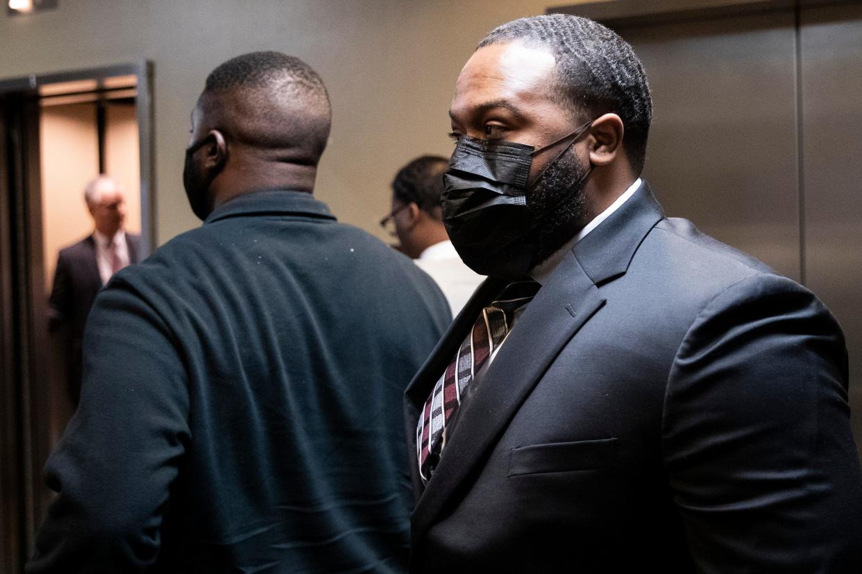 Demetrius Haley (right), Emmitt Martin III (left), and Justin Smith (center), three of the now-former Memphis police officers indicted both at the federal and state levels in connection to the beating and death of Tyre Nichols, wait to enter an elevator after a report date at Shelby County Criminal Court in Memphis, Tenn., on Friday, March 8, 2024.