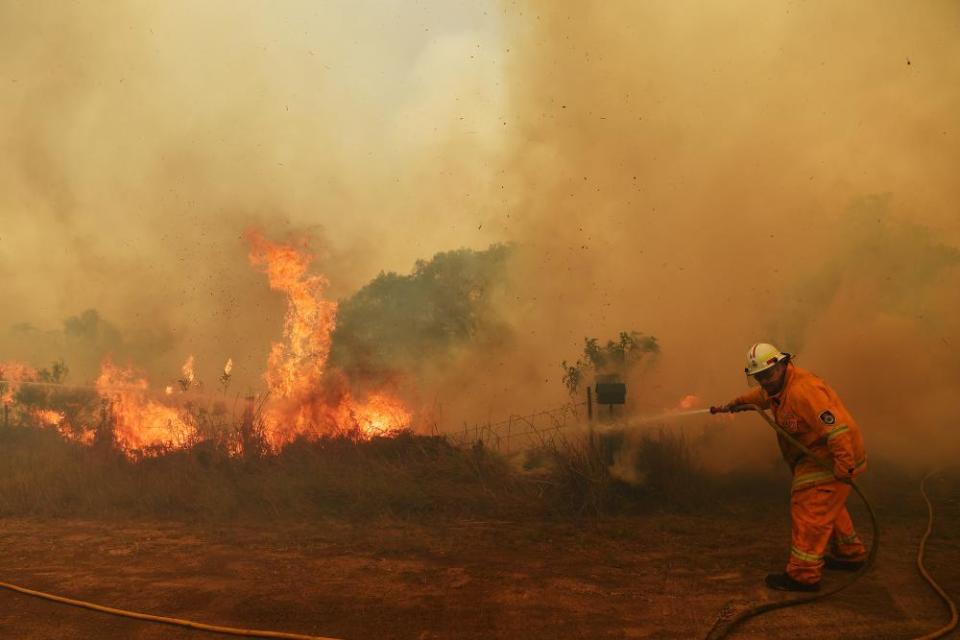 Firefighters battle a spot fire in Hillville, NSW, on Wednesday.