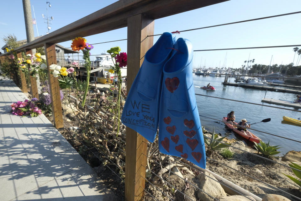 A pair of fines and flowers are placed at outside of the Sea Landing at Santa Barbara Harbor in Santa Barbara , Calif. Monday, Sept. 2, 2019. (Photo: Ringo H.W. Chiu/AP)