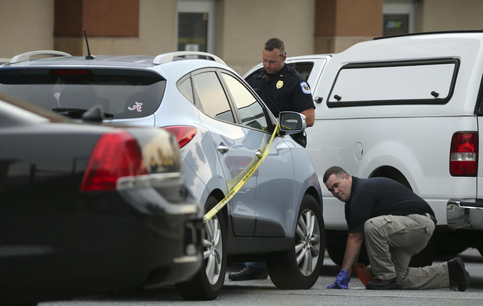 FILE - Cobb County police investigate an SUV where a toddler died, June 18, 2014, near Marietta, Ga., when the father, Justin Ross Harris, forgot to drop his child off at day care and went to work. Georgia prison records show Harris was released from Macon State Prison on Father's Day, Sunday, June 16, 2024, 10 years after his toddler died in a hot car, a case that made global headlines after prosecutors accused him of murder. (Ben Gray/Atlanta Journal-Constitution via AP, File)