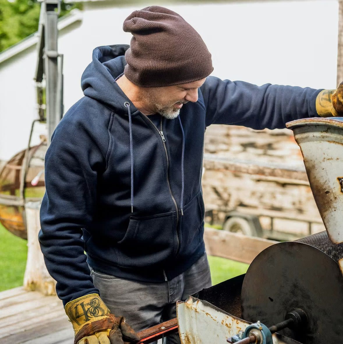 Man wearing Flint and Tinder 10-Year Hoodie