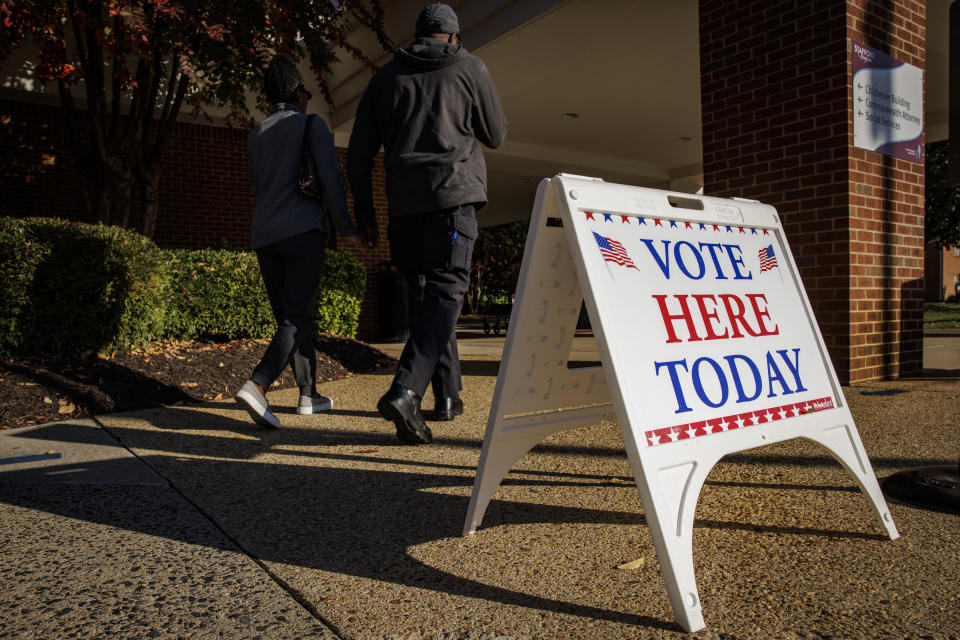 People walk into the early voting location at the Stafford County Government Center on Nov. 3 in Stafford, Va. 