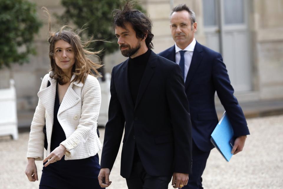 Twitter CEO Jack Dorsey, center, with Twitter officials Audrey Herblin-Stoop and Damien Viel.