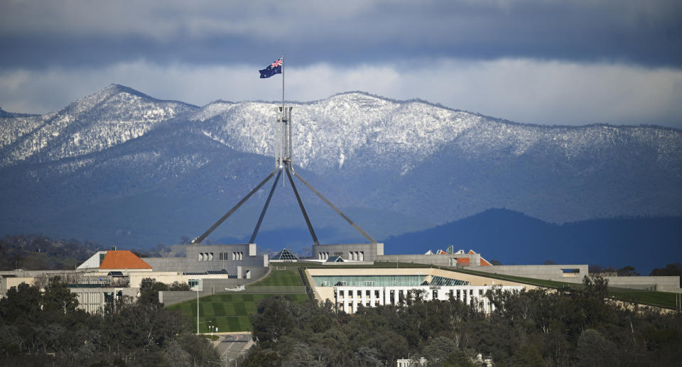 Canberra with snow covered mountains in the background