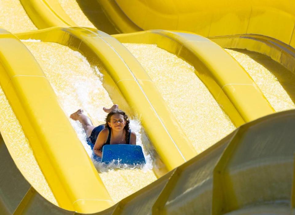 A girl goes down a water slide at Roaring Springs Waterpark.