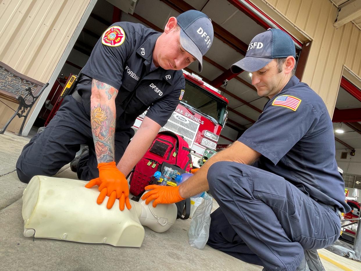 DeFuniak Springs firefighters Brian Foreman and Austin Arnold demonstrate CPR, one of the Basic Life Support medical interventions that firefighters use on their calls. The department hopes to have approval from the state of Florida by October to begin offering Advanced Life Support (ALS) services.