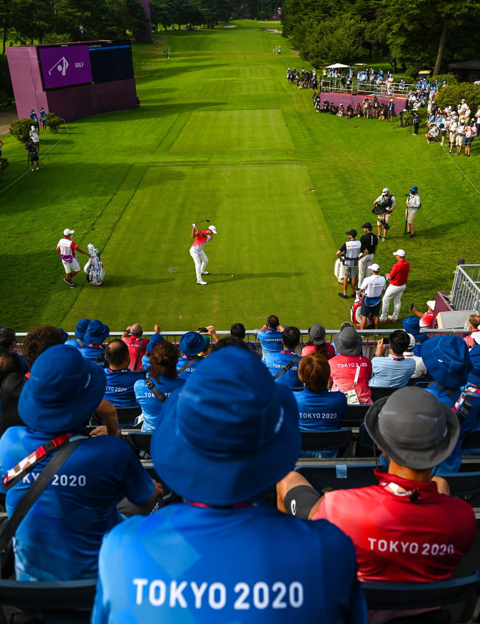 <p>Rikuya Hoshino of Japan plays his tee shot on the first hole during round 1 of the men's individual stroke play at the Kasumigaseki Country Club during the 2020 Tokyo Summer Olympic Games in Kawagoe, Saitama, Japan. (Photo By Stephen McCarthy/Sportsfile via Getty Images)</p> 