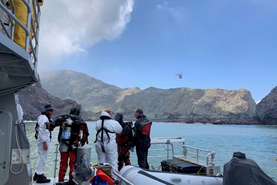 Members of a dive squad conduct a search during a recovery operation around White Island (NEW ZEALAND POLICE via REUTERS)