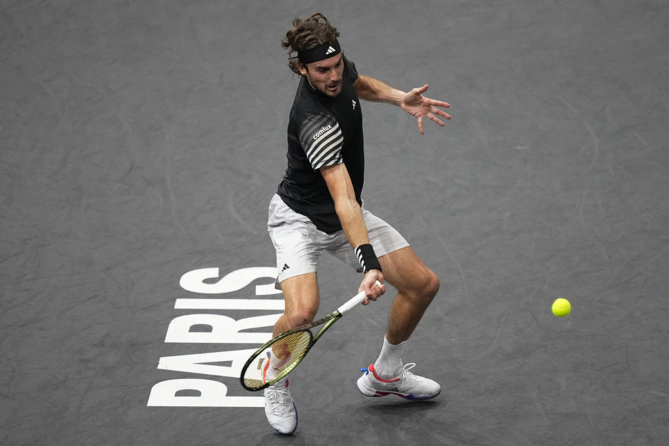 Greece's Stefanos Tsitsipas returns the ball to Germany's Alexander Zverev during their third round match of the Paris Masters tennis tournament, at the Accor Arena, Thursday Nov. 2, 2023 in Paris. (AP Photo/Michel Euler)