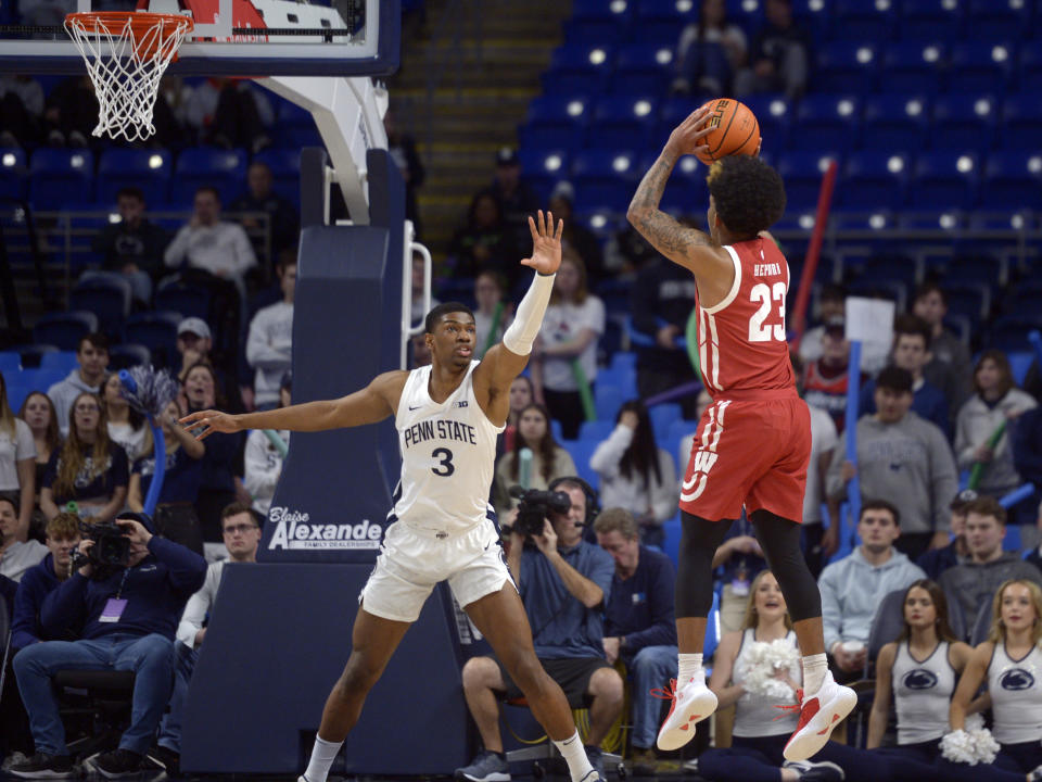 Wisconsin's Chucky Hepburn (23) pulls up to shoot on Penn State's Kebba Njie (3) during the first half of an NCAA college basketball game, Wednesday, Feb. 8, 2023, in State College, Pa. (AP Photo/Gary M. Baranec)