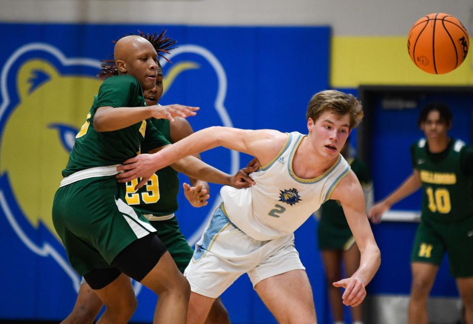 Brentwood's Daniel Cochran (2) tries to gain control of the ball against Hillsboro's Cortez Graham (12)  during the second quarter at Brentwood High School in Brentwood, Tenn., Tuesday, Feb. 7, 2023. 