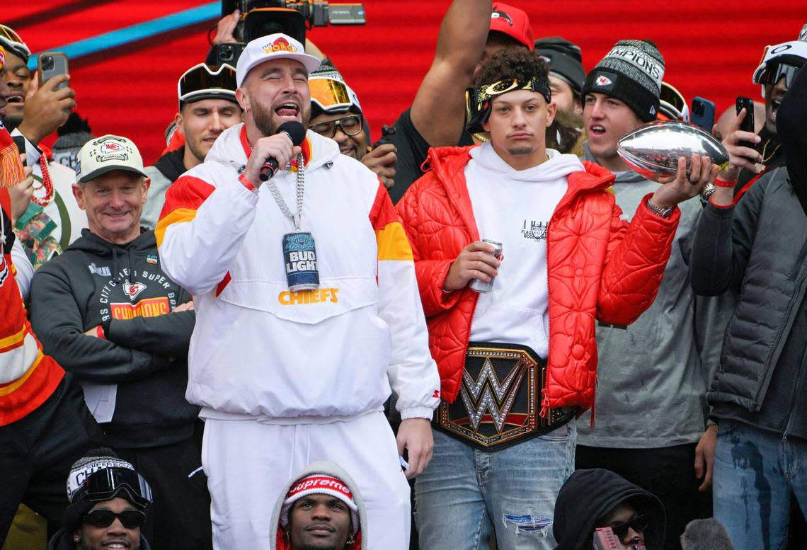 Kansas City Chiefs tight end Travis Kelce addresses the crowd as quarterback Patrick Mahomes and teammates looked on at Union Station for the Super Bowl Champions parade and rally on Wednesday, Feb. 15, 2023, in Kansas City.