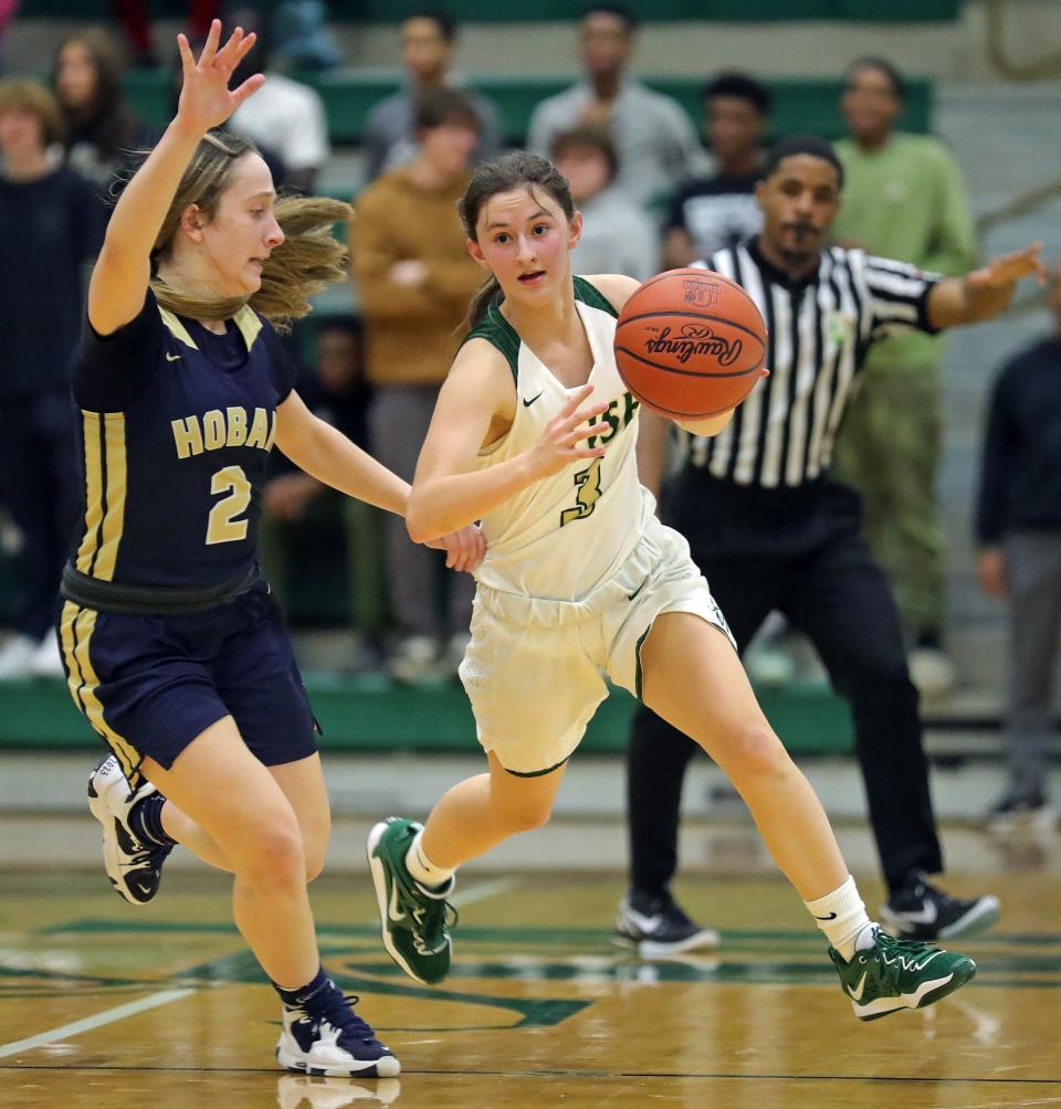 STVM guard Kendal Batchik takes the ball down the court against Hoban's Kennedy Arison on Feb. 1, 2023.