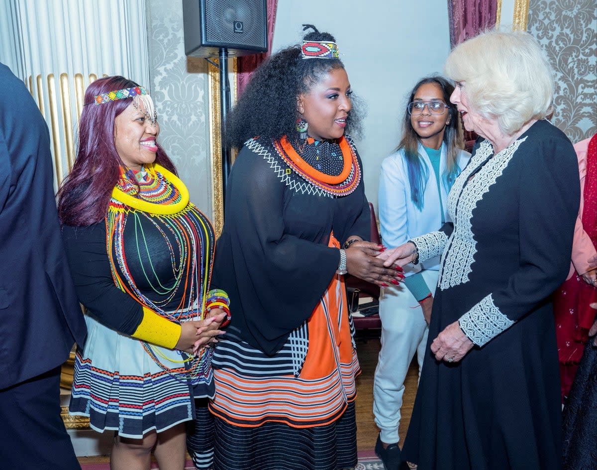 Britain's Queen Camilla speaks with guests during the annual Commonwealth Day reception at Marlborough House in London on March 11, 2024 (via REUTERS)