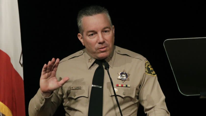 FILE - In this Dec. 3, 2018 file photo newly-elected Los Angeles County Sheriff Alex Villanueva speaks during a swearing-in ceremony in Monterey Park, Calif. Villanueva will limit when inmates in the county's jails can be transferred to federal authorities for deportation. Sheriff's Department spokeswoman Nicole Nishida said on Friday, Feb. 15, 2019, the agency will reduce the number of misdemeanor charges that can trigger an inmate's transfer. She could not immediately say which misdemeanor charges would no longer qualify. (AP Photo/Jae C. Hong, File)