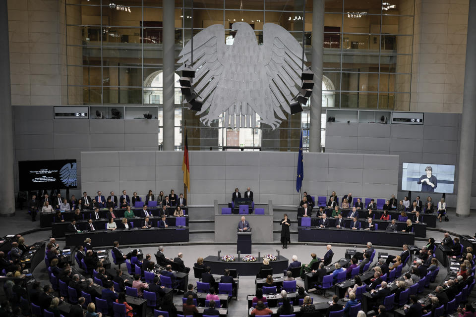 FILE - Britain's King Charles III, center, addresses the Bundestag, Germany's Parliament, in Berlin, Thursday, March 30, 2023. King Charles III won plenty of hearts during his three-day visit to Germany, his first foreign trip since becoming king following the death of his mother, Elizabeth II, last year. (AP Photo/Markus Schreiber, File)