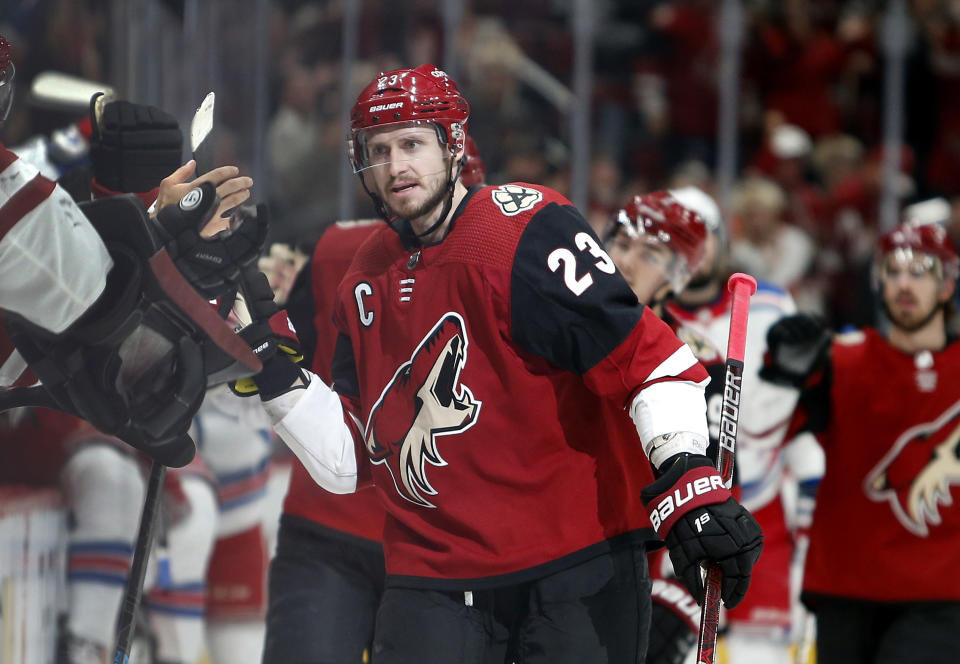 Arizona Coyotes defenseman Oliver Ekman-Larsson (23) is congratulated by teammates after scoring a goal against the New York Rangers during the first period of an NHL hockey game, Sunday, Jan. 6, 2019, in Glendale, Ariz. (AP Photo/Ralph Freso)