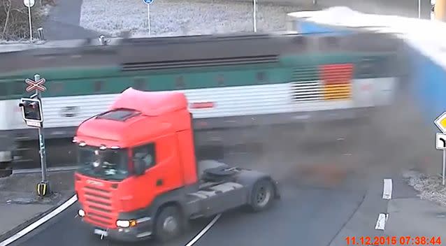 The cab of the truck becomes disconnected from the back of the truck, saving the life of the driver. Photo: YouTube